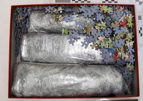 Drugs disguised in a children's puzzle set. Image: Met Police.