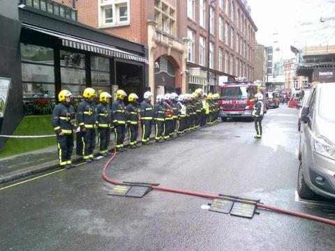 London Firefighters parade in Wardour Street in respect for VE Day after tackling kitchen blaze. Image: @LondonFire